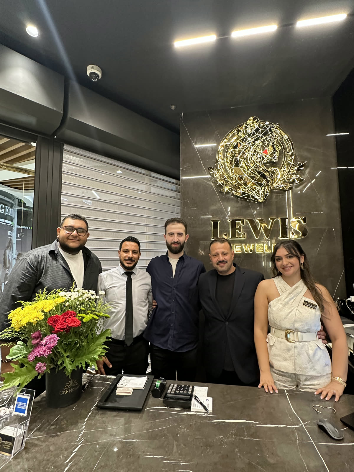 The implementation team at the Lewis Jewelry counter during the grand opening.