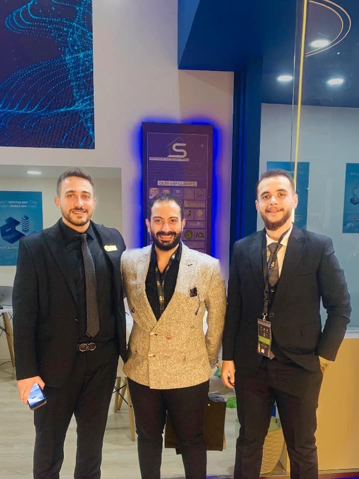 Three SWH colleagues at the company stand during NEBU Expo 2024.